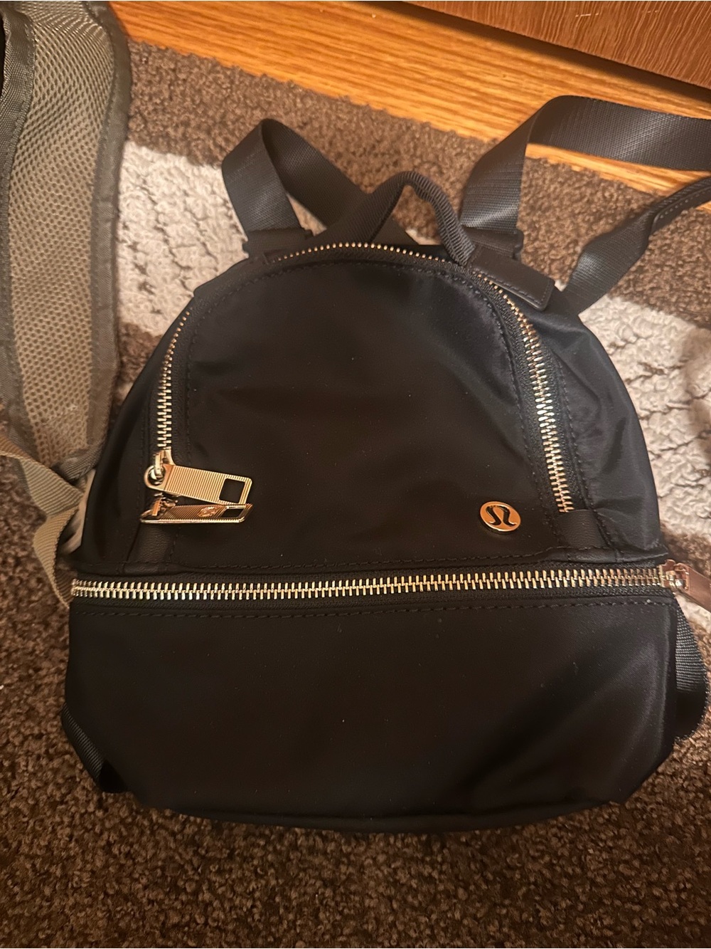 lululemon athletica Black Mini Backpack with Gold Accents